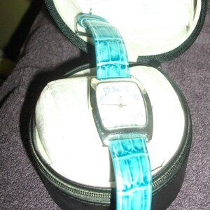 Women's Thermidor wristwatch, teal snakeskin pattern.